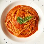 Easy veggie pasta for picky eaters in a white bowl with tomato sauce